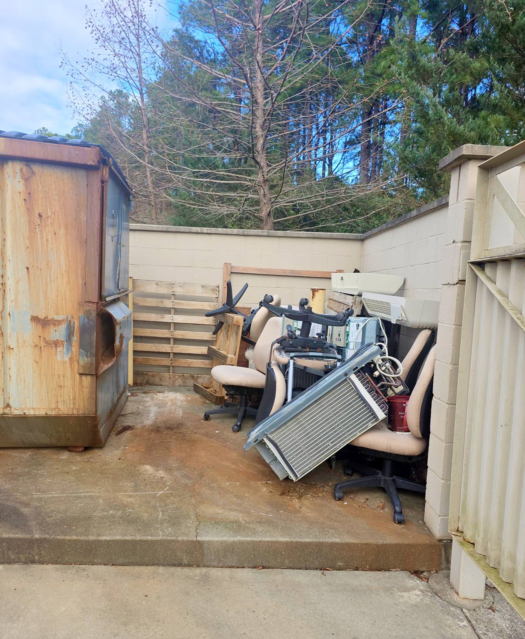 Before photo – cluttered property in Augusta GA ready for junk removal