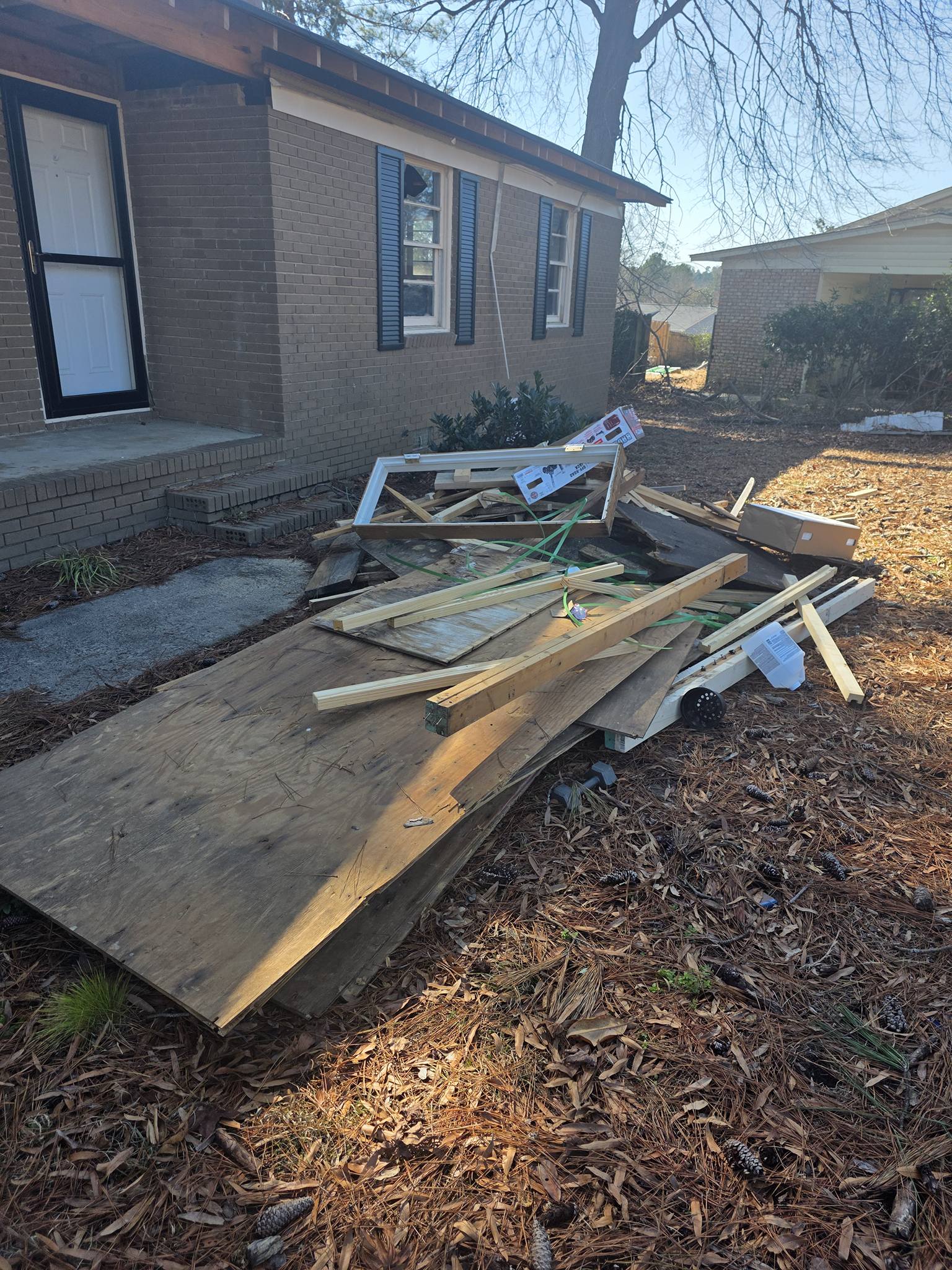 Debris pile outside house before pickup